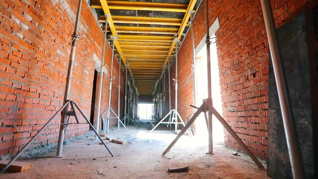 Inside a building under construction. Construction industry. The process of creating a floor. Formwork flooring. formwork rack.