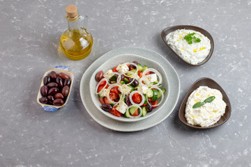 Greek salad with tzatziki, olives and feta cream. Traditional salad, meze,  with olive oil