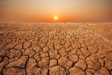 a barren land under the setting sun