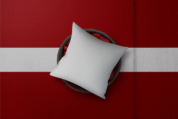 Patriotic pillow mock up on background in colors of national flag. Latvia