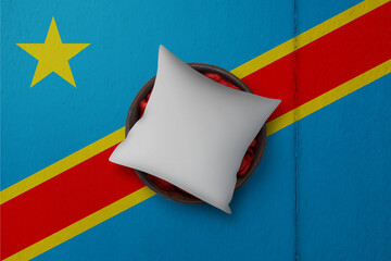 Patriotic pillow mock up on background in colors of national flag. Democratic Republic of the Congo