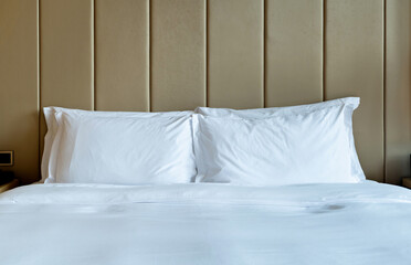 White pillows and duvet on a bed
