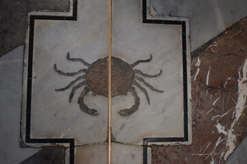 Symbol of the zodiac sign Cancer on the floor of the Metropolitan Cathedral of the Assumption of...