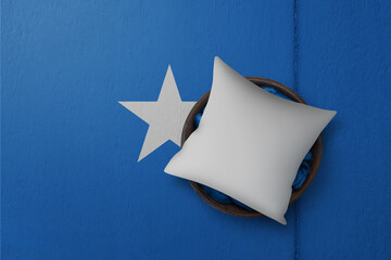 Patriotic pillow mock up on background in colors of national flag. Somalia