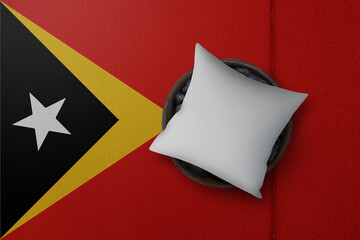 Patriotic pillow mock up on background in colors of national flag. Timor East