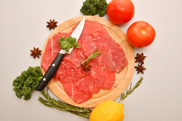 Carpaccio dish of thinly sliced pieces (slices) raw beef tenderloin 