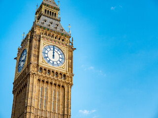 Big Ben at midday. Close detail of the iconic London landmark clock tower at exactly 12 o'clock mid...