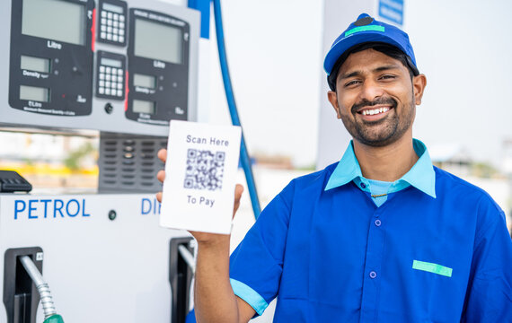 Rack Focus Shot Of Petrol Pump Worker Showing Scan Here To Pay Qr Code For Payment By Looking At Camera - Concept Of Online Or Contact Less Payment At Technology Gas Filling Station.