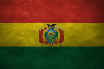 Patriotic stone wall background in colors of national flag. Bolivia