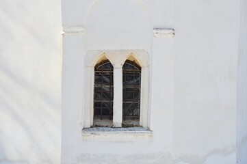 old window of a white church