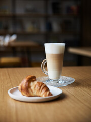 coffee and croissant on the table