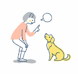 犬にコマンドを言っている若い女性