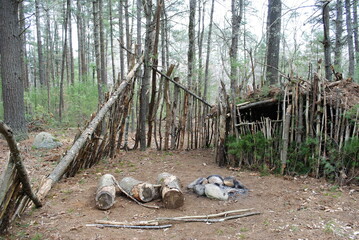 Primitive / Survival structure semi-permanent build with wind / privacy screen and campfire pit
