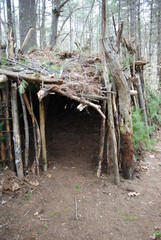 Primitive / Survival structure semi-permanent build with wind / privacy screen and campfire pit
