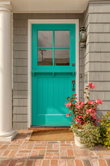A off green front door of a house.