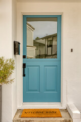 Fototapeta na wymiar Front door, turquoise front door that is an entrance to a house
