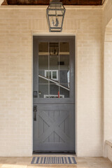 Dark gray front door that is secured. Front door entrance to the house.
