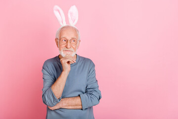 Photo of unsure old grey hairdo man look promo wear eyewear blue pullover ears isolated on pink color background