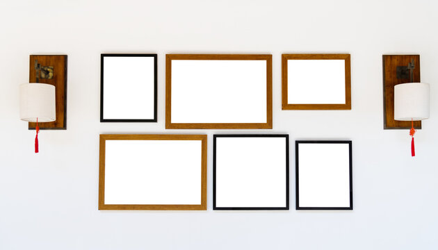 Empty picture frames hanging on white wall