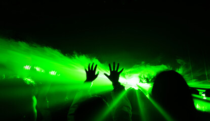 Crowd and blurred green light