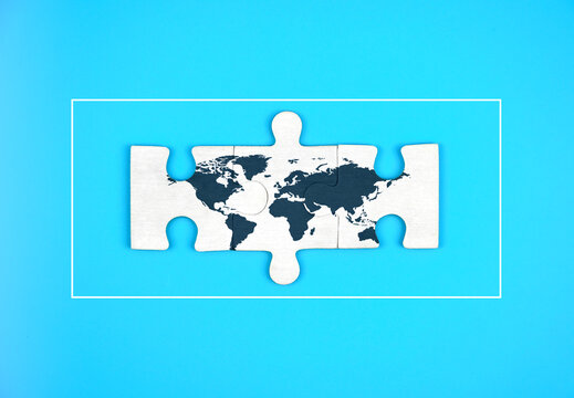 world map on jigsaw puzzle blue background.             