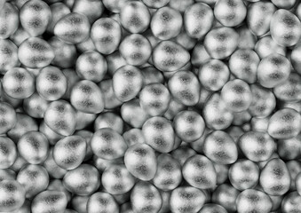 Chocolate easter eggs with silver Aluminium foil. Wallpaper. backdrop.	
