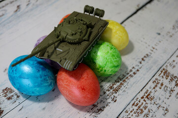 no easter for europe because of russia ukraine war conflict crisis toy tank on easter eggs