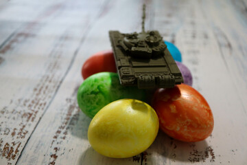 no easter for europe because of russia ukraine war conflict crisis toy tank on easter eggs