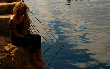 the woman at dawn on the fishermen's wharf