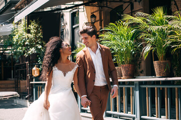 Luxurious wedding couple. Clear, even skin. Photo shoot outdoors with natural light. Portrait of a couple in love in wedding day.