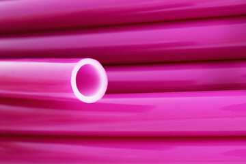 Flexible pipe on underfloor heating made of cross-linked polyethylene with an oxygen barrier. Materials for home insulation. Innovative technology. Installation for comfort and coziness.

