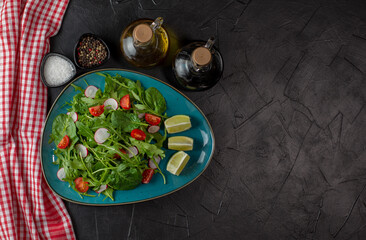 Fresh salad mix of baby spinach, arugula leaves. Vegan breakfast, vegetarian food. Copy space