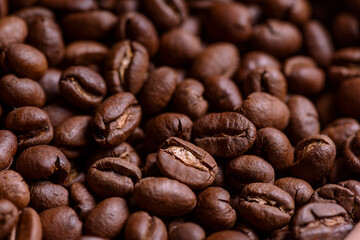 Naklejka premium Coffee. Closeup coffee beans with out of focus background.