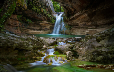 Waterfall inside a cave in the mountain
