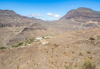 Fototapeta na wymiar View of Veneguera village and barren mountains, Gran Canaria