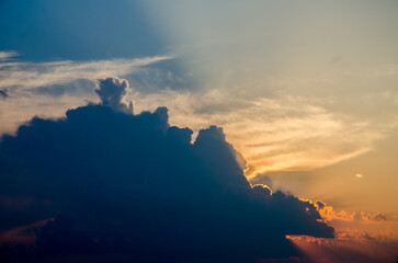 Sunset / sunrise with clouds, light rays and other atmospheric effect