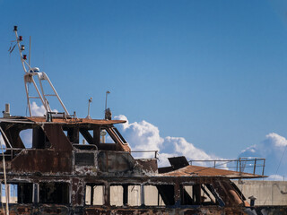 Fototapeta na wymiar Detail view of a burnt out luxury yacht