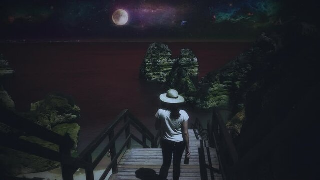 Woman Stairway Extraterrestrial Beach Night Planets In Space. Woman going downstairs straight to a surreal beach scene with full moon and planets in space