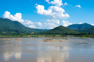 Fototapeta na wymiar Lanscape riverside of Mae Khong river and mountain views border of Thailand and Laos at the Kaeng Khud Khu rapids at Chiang Khan in Loei province, Thailand.