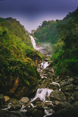waterfall in the mountains in forest.
