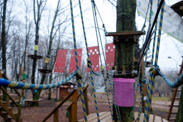 Fototapeta na wymiar Rope park structures on trees