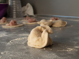 dough pieces and meat on the table