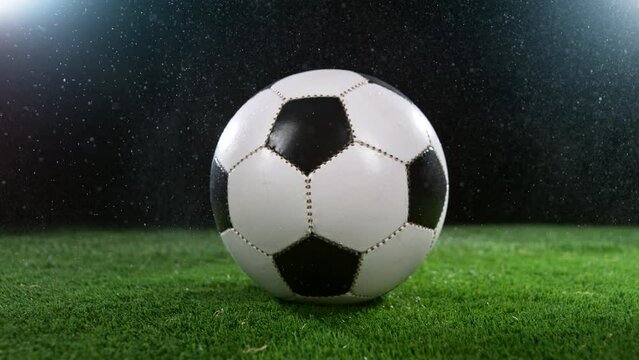 Close-up of Rotating Soccer Ball on Football Field, Super Slow Motion at 1000 fps. Filmed on High Speed Cinematic Camera at 1000 fps.