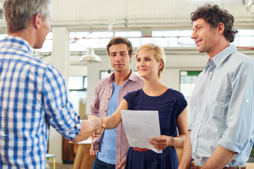Poster every beginning comes from some other beginnings end. shot of a businesspeople shaking hands in an o
