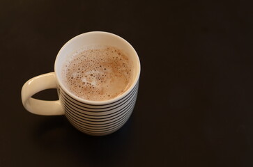 cup of coffee on black background