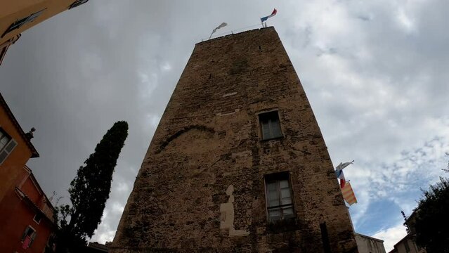 Grasse, France,  October 3, 2021: DOLLY SLOW MOTION SHOT - The former Bishop's Palace now serving as Grasse City Hall. A tufa tower constitutes the remains of the medieval bishop&rsquo;s palace.