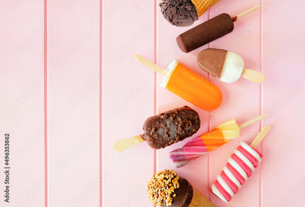Poster mixture of chocolate and colorful summer popsicles and ice cream treats. top down view side border o