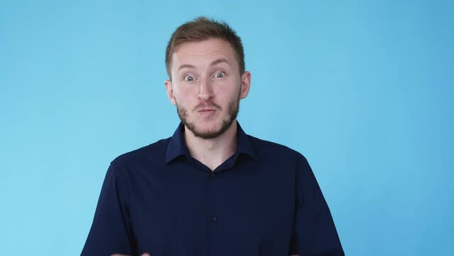 Wow reaction. Impressed man. Pleasant surprise. Boomerang animation. Happy smiling guy with satisfied expression isolated on blue background GIF loop motion.