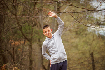 preparing for a sports competition, a young man performing exercises outdoor