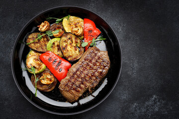 Juicy steak and grilled vegetables, with spices